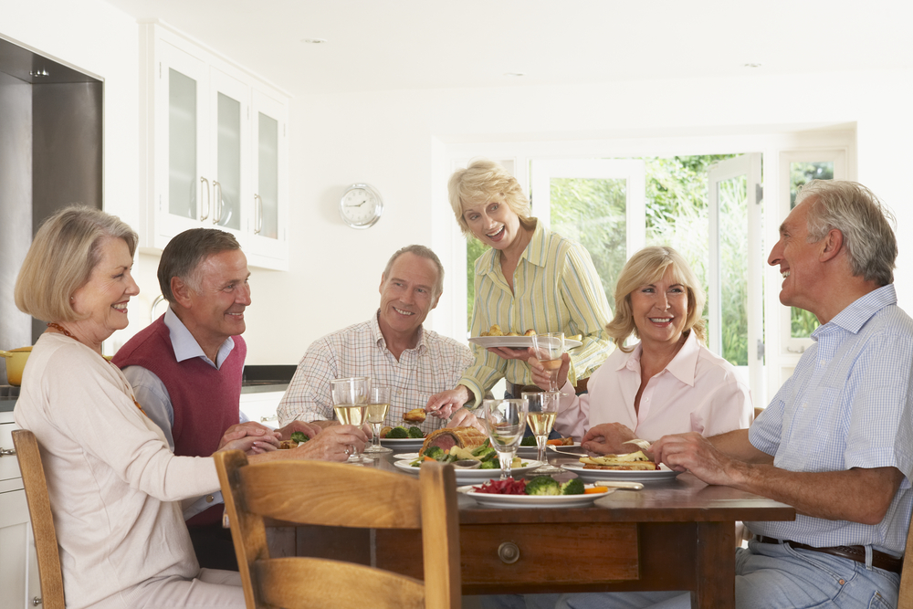 Friends Enjoying Lunch At Home Together